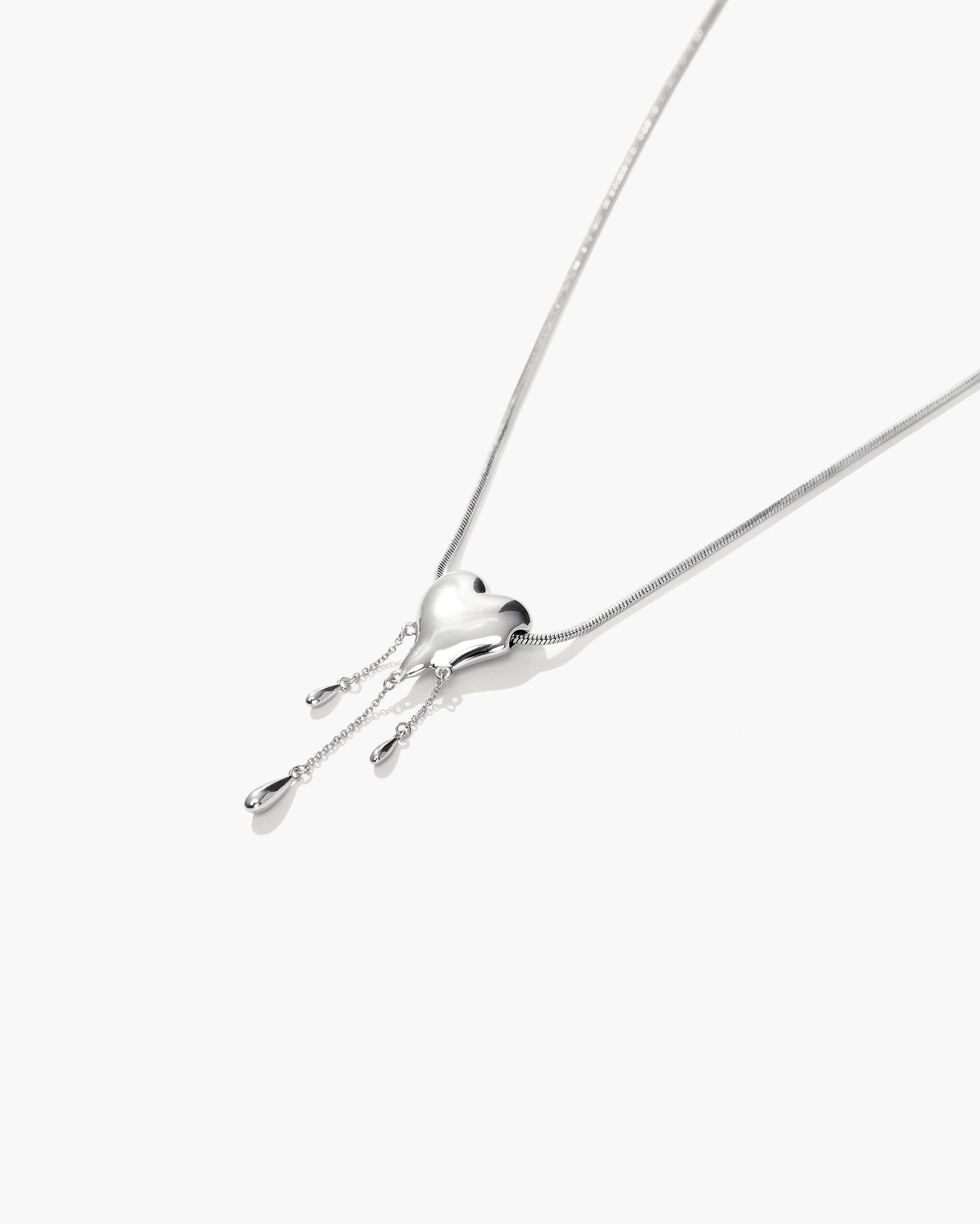 Venom’s Golden Drip Heart Necklace in Silver - Image 3